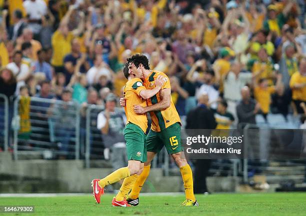 Brett Homan of the Socceroos celebrates with Mile Jedinak after scoring a goal during the FIFA 2014 World Cup Qualifier match between the Australian...