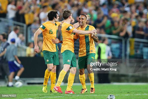 Brett Homan of the Socceroos celebrates with Mile Jedinak and Archie Thompson after scoring a goal during the FIFA 2014 World Cup Qualifier match...