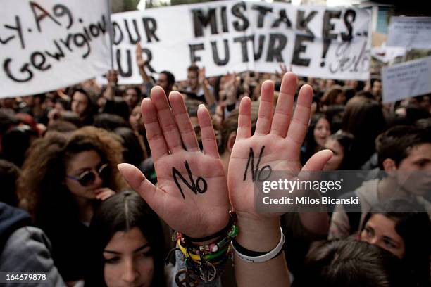 Students protest against austerity measures in front of Cypriot Parliament building on March 26, in Nicosia, Cyprus. After days of negotiation,...