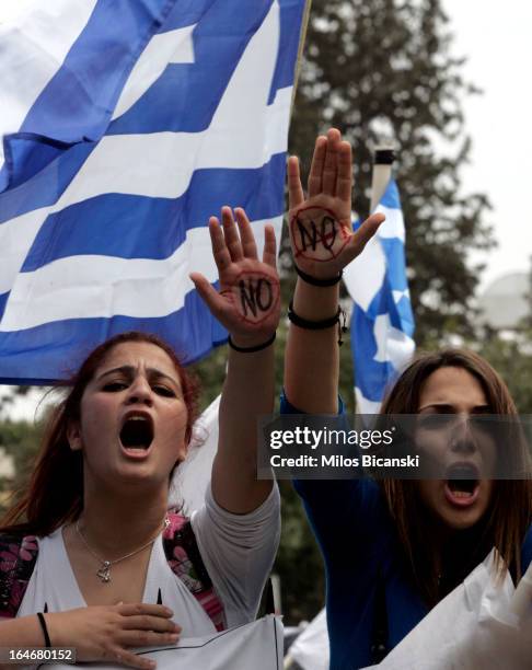 Students protest against austerity measures in front of Cypriot Presidential House on March 26, in Nicosia, Cyprus. After days of negotiation,...