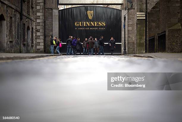 Visitors pass an entrance to the Guinness St. James's Gate Brewery, a brand of Diageo Plc, in Dublin, Ireland, on Saturday, March 16, 2013. Ireland’s...