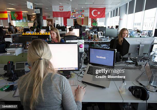 Employees at Facebook are seen working inside the office of Facebook Inc.'s European headquarters at Hanover Quay in Dublin, Ireland, on Thursday,...