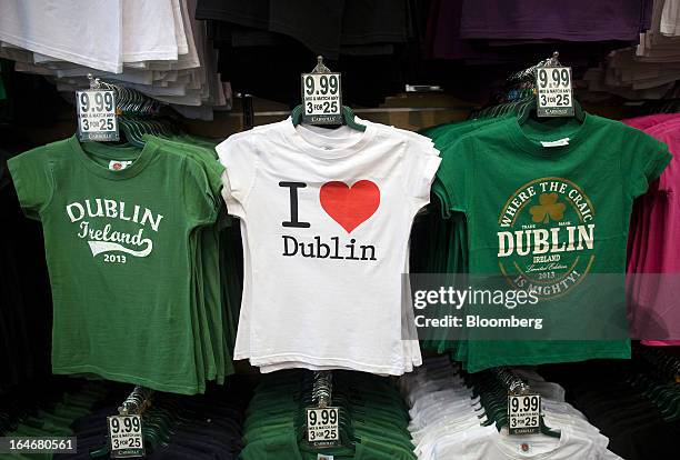 Shirt branded with 'I Love Dublin' and sits alongside shirts bearing other slogans for sale in the window of a souvenir store in Dublin, Ireland, on...