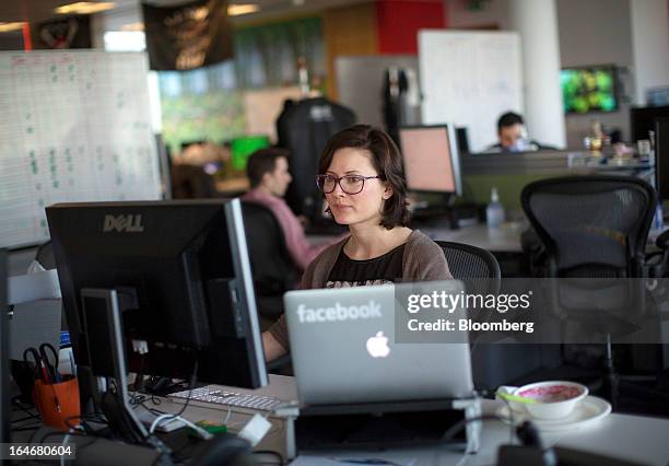 Employees at Facebook are seen working inside the office at Facebook Inc.'s European headquarters at Hanover Quay in Dublin, Ireland, on Thursday,...