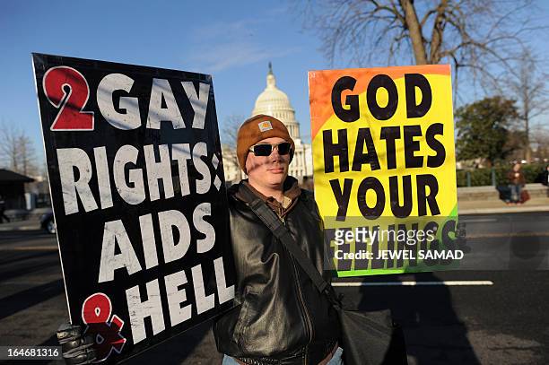 Anti-gay protesters display placards in front of the US Supreme Court on March 26, 2013 in Washington, DC. Same-sex marriage takes center stage at...