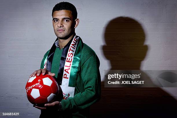 Palestinian footballer Mahmud Sarsak poses on March 26, 2013 in Paris, where he begins today a campaign for the cancelation of the under 21 Euro...