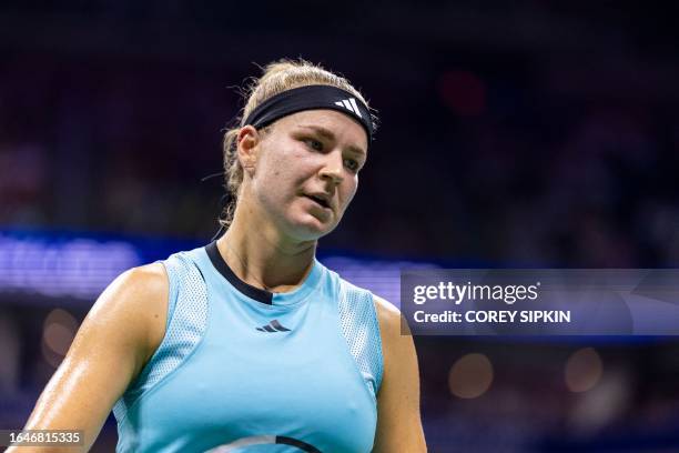 Czech Republic's Karolina Muchova walks to the baseline during the US Open tennis tournament women's singles quarter-finals match against Romania's...