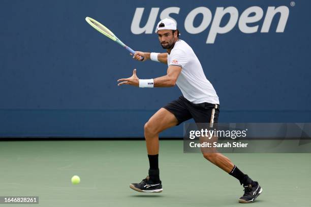 Matteo Berrettini of Italy returns a shot against Ugo Humbert of France during their Men's Singles First Round match on Day Two of the 2023 US Open...