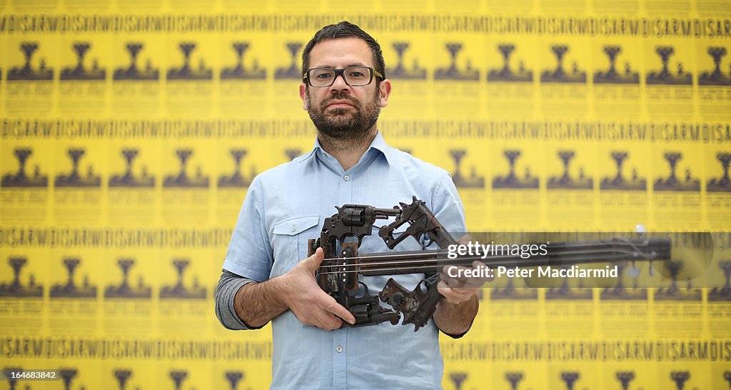 Mexican Artist Pedro Reyes Rehearses Using Musical Instruments He Has Created From Weapons Confiscated From Mexican Cartels