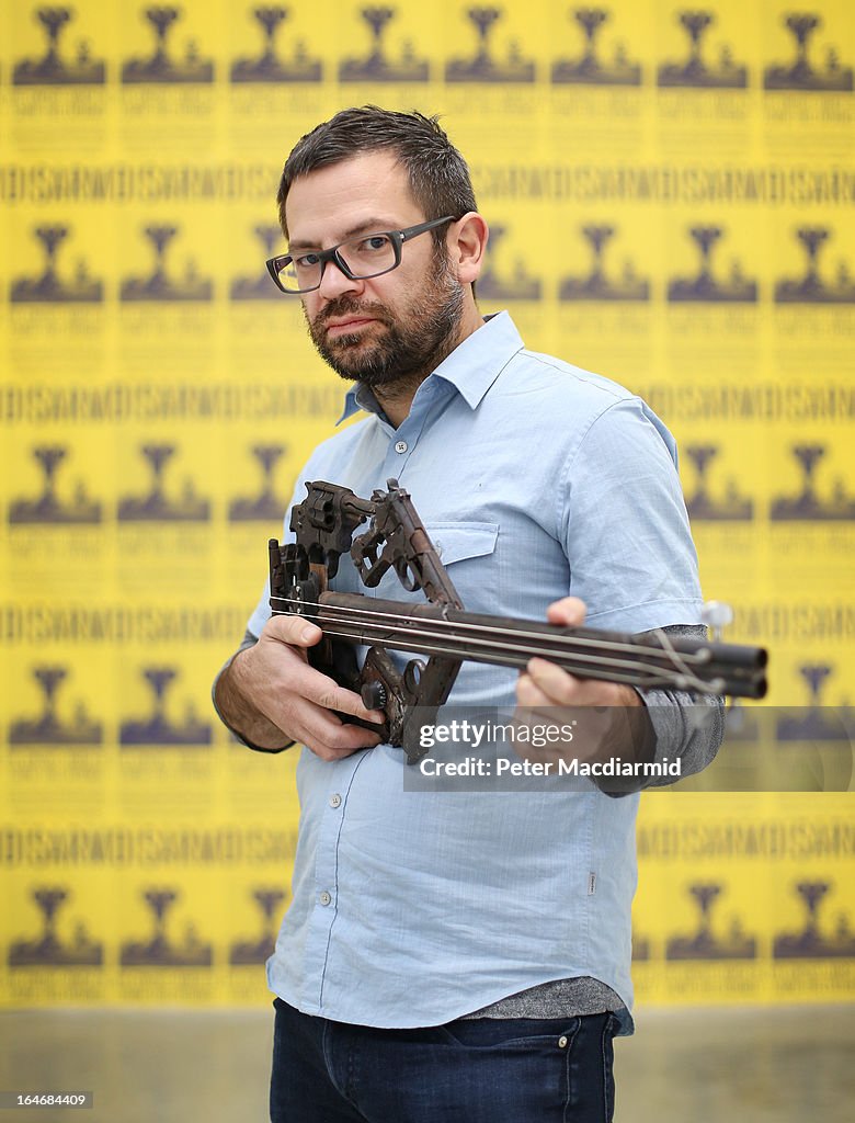 Mexican Artist Pedro Reyes Rehearses Using Musical Instruments He Has Created From Weapons Confiscated From Mexican Cartels