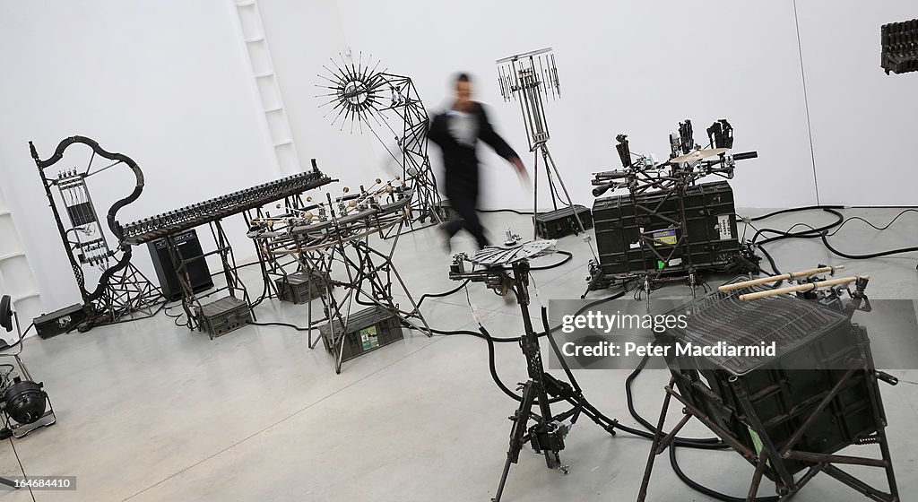 Mexican Artist Pedro Reyes Rehearses Using Musical Instruments He Has Created From Weapons Confiscated From Mexican Cartels