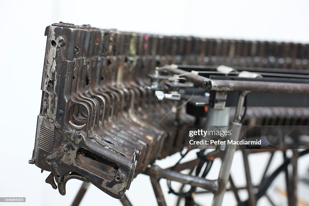 Mexican Artist Pedro Reyes Rehearses Using Musical Instruments He Has Created From Weapons Confiscated From Mexican Cartels