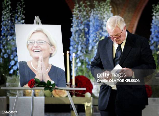 European Union's External Relations Commissioner British Chris Patten bows his head after making a speech during the official memorial service for...