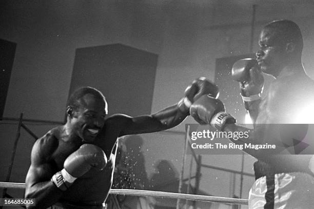 Dwight Muhammad Qawi throws a punch against James Scott during the fight at the Rahway State Prison in Woodbridge Township, New Jersey. Dwight...