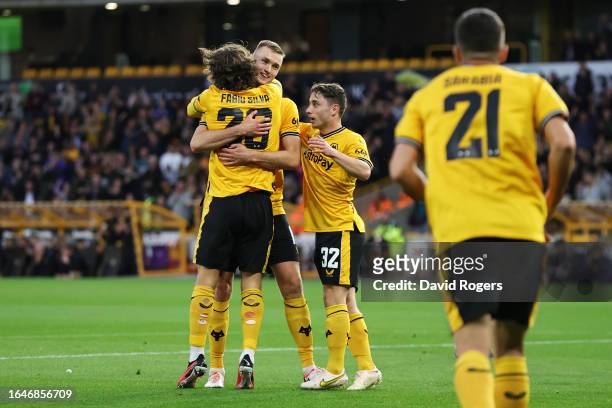 Sasa Kalajdzic of Wolverhampton Wanderers celebrates with teammates after scoring the team's first goal during the Carabao Cup Second Round match...
