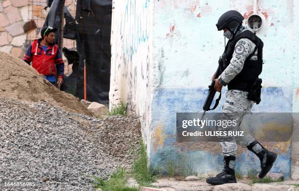 Member of the National Guard patrols during an operation in one of the conflictive suburbs in Lagos de Moreno, Jalisco State, Mexico, on August 29,...