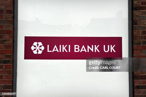 General view of a sign in the window of a branch of Laiki Bank UK, a subsiduary of Cyprus Popular Bank , in north London on March 26, 2013. British...