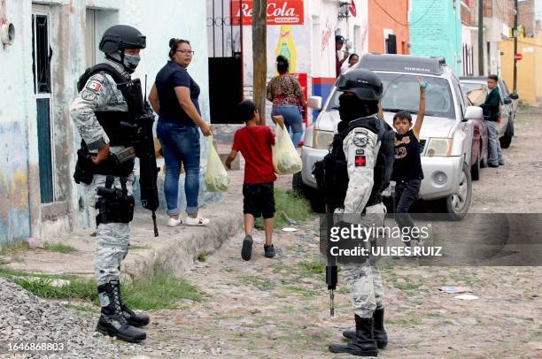 Members of the National Guard patrol during an operation in one of the conflictive suburbs in Lagos de Moreno, Jalisco State, Mexico, on August 29,...