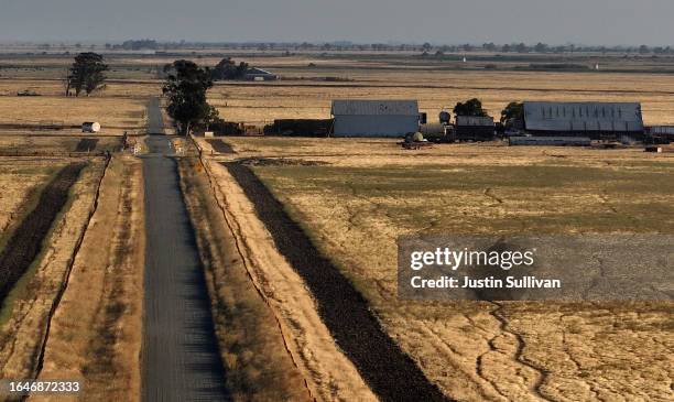 In an aerial view, a barn stands on a parcel of land that was recently purchased near Travis Air Force Base on August 29, 2023 near Rio Vista,...