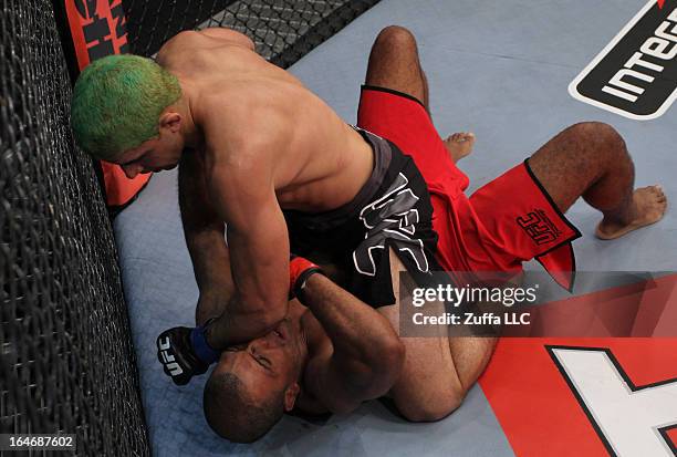 Bruno "Jacare" Dias punches Cleiton "Foguete" Duarte in their elimination fight during filming of season two of The Ultimate Fighter Brazil on...