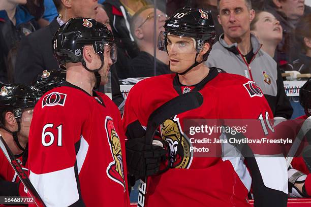 Teammates Andre Benoit and Mike Lundin of the Ottawa Senators talk, during an NHL game against the Boston Bruins, at Scotiabank Place, on March 21,...