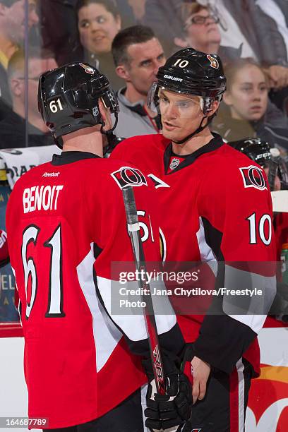 Teammates Andre Benoit and Mike Lundin of the Ottawa Senators talk, during an NHL game against the Boston Bruins, at Scotiabank Place, on March 21,...