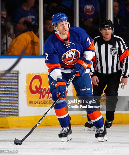 Matt Carkner of the New York Islanders skates in an NHL hockey game against the Pittsburgh Penguins at Nassau Veterans Memorial Coliseum on March 22,...