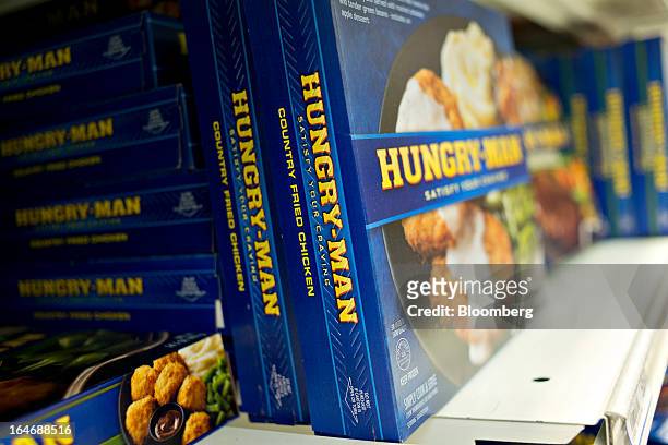 Pinnacle Foods Hungry-Man brand frozen dinners sit on display for sale at a supermarket in Princeton, Illinois, U.S., on Tuesday, March 26, 2013....