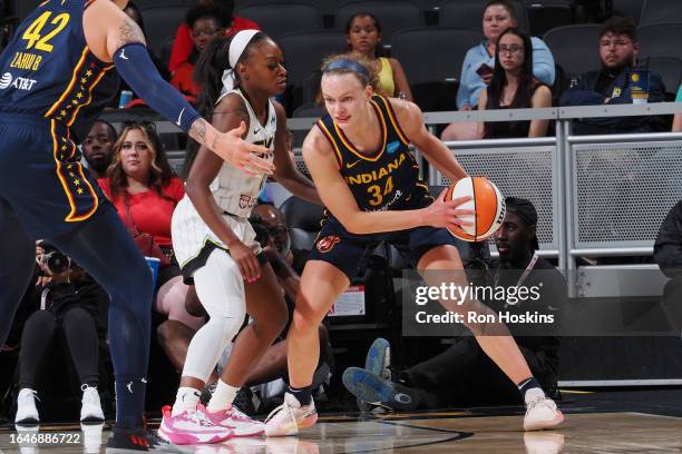 Grace Berger of the Indiana Fever looks to pass the ball during the game against the Chicago Sky on September 5, 2023 at Gainbridge Fieldhouse in...