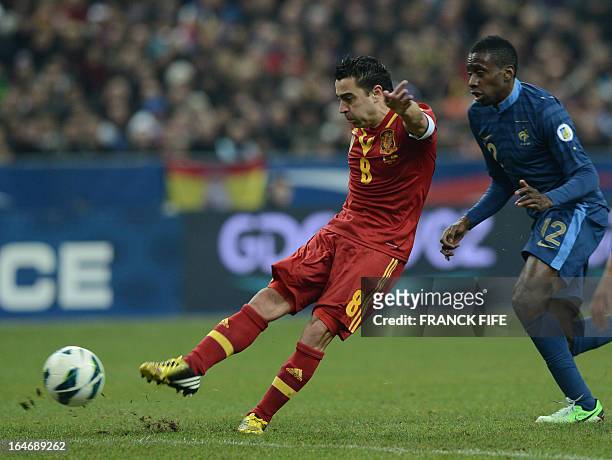 Spain's midfielder Xavi Hernandez strikes eyed by France's midfielder Blaise Matuidi during the World Cup 2014 qualifying football match France vs...