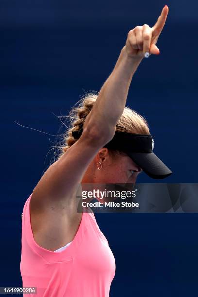Yulia Putintseva of Kazakhstan celebrates winning a game against Martina Trevisan of Italy in the second set during their Women's Singles First Round...
