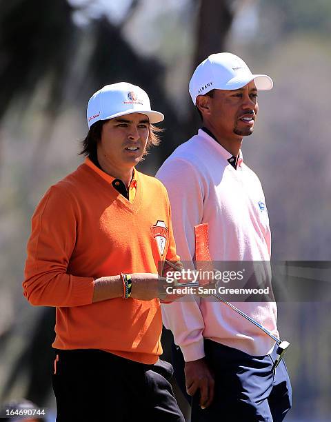 Rickie Fowler of Team Oak Tree National and Tiger Woods of Team Albany wait to play a shot on the 17th hole during the second day of the Tavistock...