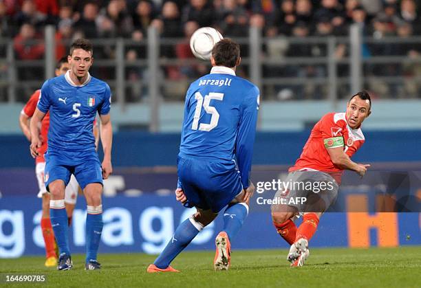 Malta's Michael Mifsud kicks the ball during the FIFA 2014 World Cup qualifying football match Malta vs.Italy at the National Stadium in Malta on...