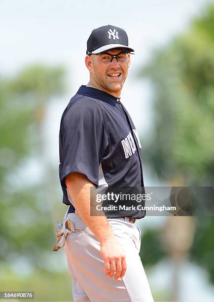 Kevin Youkilis of the New York Yankees looks on during the spring training game against the Detroit Tigers at Joker Marchant Stadium on March 23,...