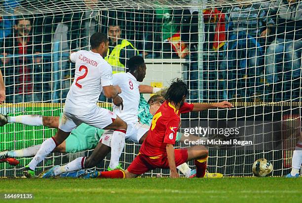 Dejan Damjanovic of Montenegro scores the equalising goal during the FIFA 2014 World Cup Qualifier Group H match between Montenegro and England at...