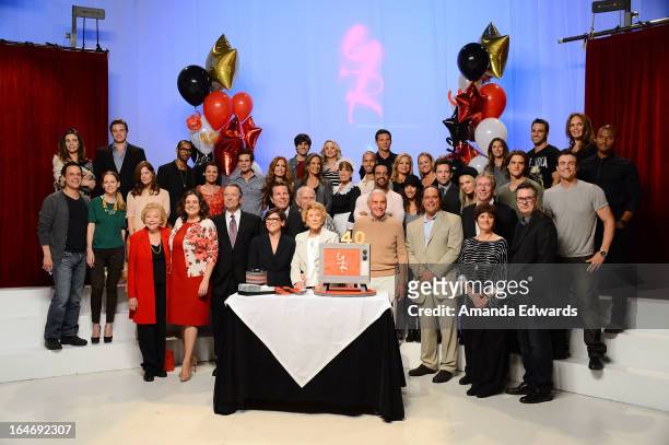Actress Jeanne Cooper poses along with the cast of the "Young & The Restless" during the "The Young & The Restless" 40th anniversary cake-cutting...