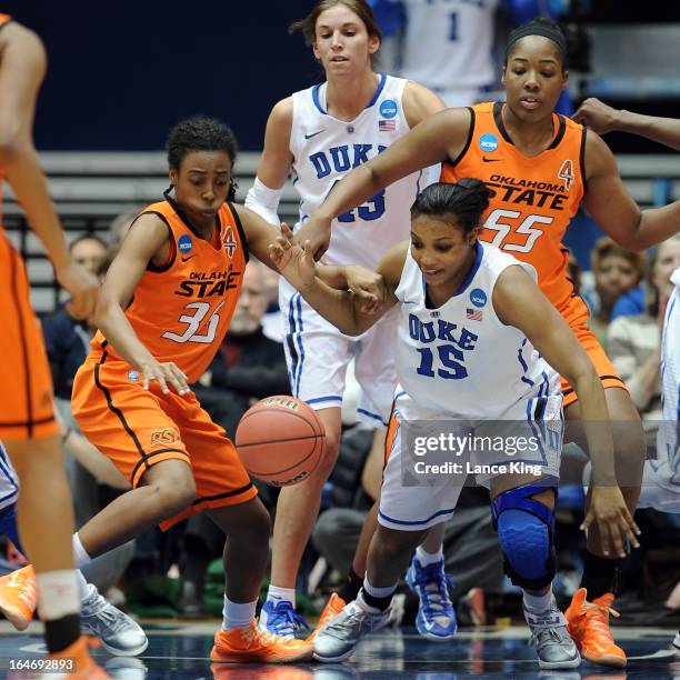 Kamri Anderson of the Oklahoma State Cowgirls and Richa Jackson of the Duke Blue Devils fight for a loose ball during the second round of the 2013...