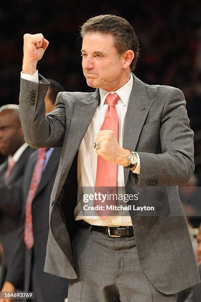 Head coach Rick Pitino of the Louisville Cardinals celebrates a shot during a semifinals Big East Basketball Tournament game against the Notre Dame...
