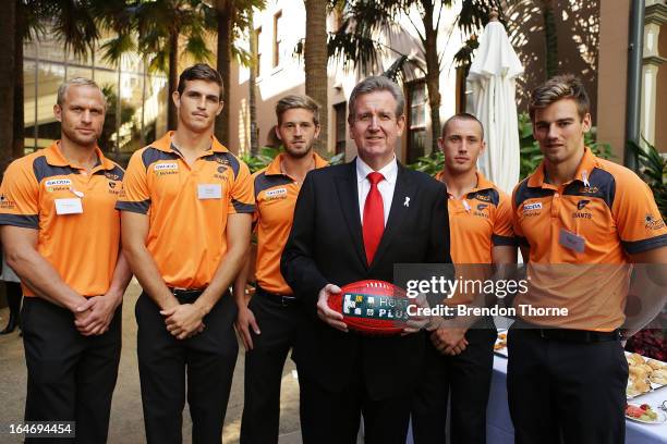 Premier, Barry O'Farrell poses with Giants players during a Sydney Swans and Greater Western Sydney AFL reception at NSW Parliment on March 27, 2013...