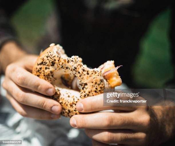 man biting a sandwich - chewing with mouth open stock pictures, royalty-free photos & images