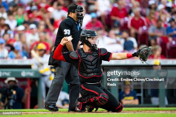 Tyler Stephenson of the Cincinnati Reds throws the ball back during a game against the Milwaukee Brewers at Great American Ball Park on July 14, 2023...