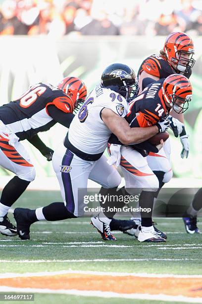 Ma'ake Kemoeatu of the Baltimore Ravens sacks Andy Dalton of the Cincinnati Bengals during their game at Paul Brown Stadium on December 30, 2012 in...