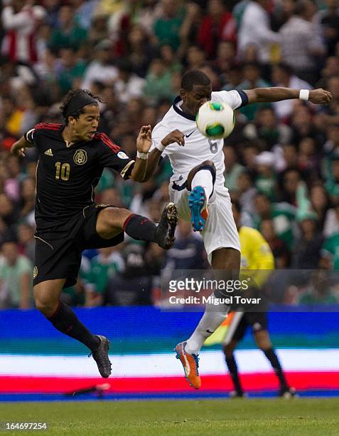 Giovani dos Santos of Mexico fights for the ball with Maurice Edu of the United States during a match between Mexico and US as part of FIFA 2014...