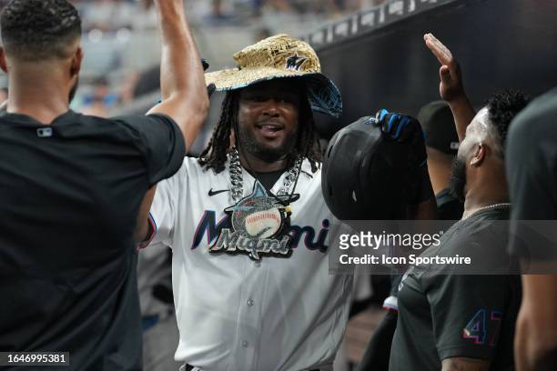 Miami Marlins left fielder Bryan De La Cruz celebrates his two run homer in the dugout during the game between the Los Angeles Dodgers and the Miami...