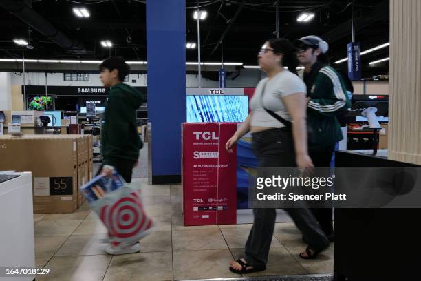 People shop at a Best Buy store in a Brooklyn mall on August 29, 2023 in New York City. Shares of the tech retail chain rose 6% to $78.50 Tuesday...