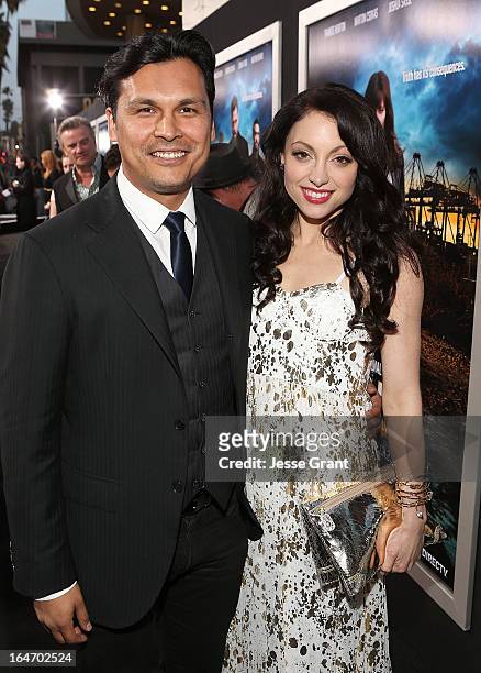 Actors Adam Beach and Leah Gibson attend the Los Angeles Premiere of 'Rogue' at ArcLight Cinemas on March 26, 2013 in Hollywood, California.