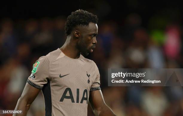 Davinson Sanchez of Tottenham Hotspur looks dejected after missing their team's third penalty in the penalty shoot out during the Carabao Cup Second...