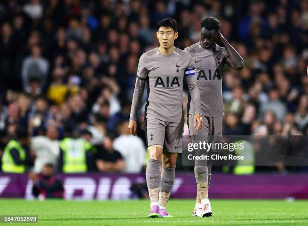 Heung-Min Son and Davinson Sanchez of Tottenham Hotspur look dejected after their loss in the penalty shoot out following the Carabao Cup Second...