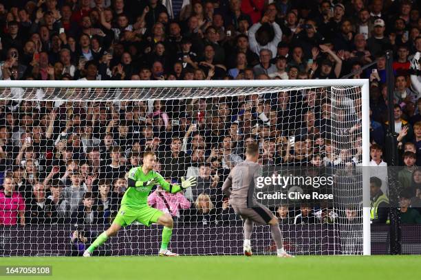 James Maddison of Tottenham Hotspur scores their sides fourth penalty in the penalty shoot out during the Carabao Cup Second Round match between...
