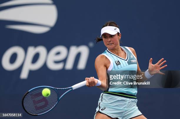 Caroline Dolehide of the United States returns a shot against Clara Burel of France during their Women's Singles First Round match on Day Two of the...